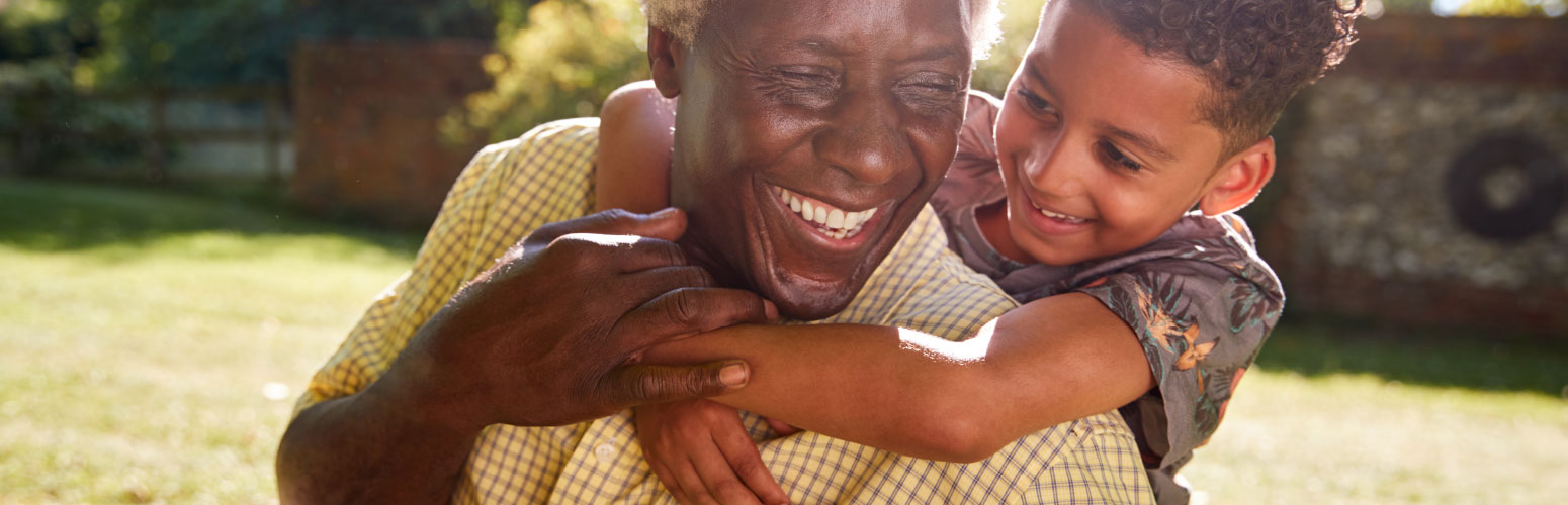 Grandfather and grandson smiling